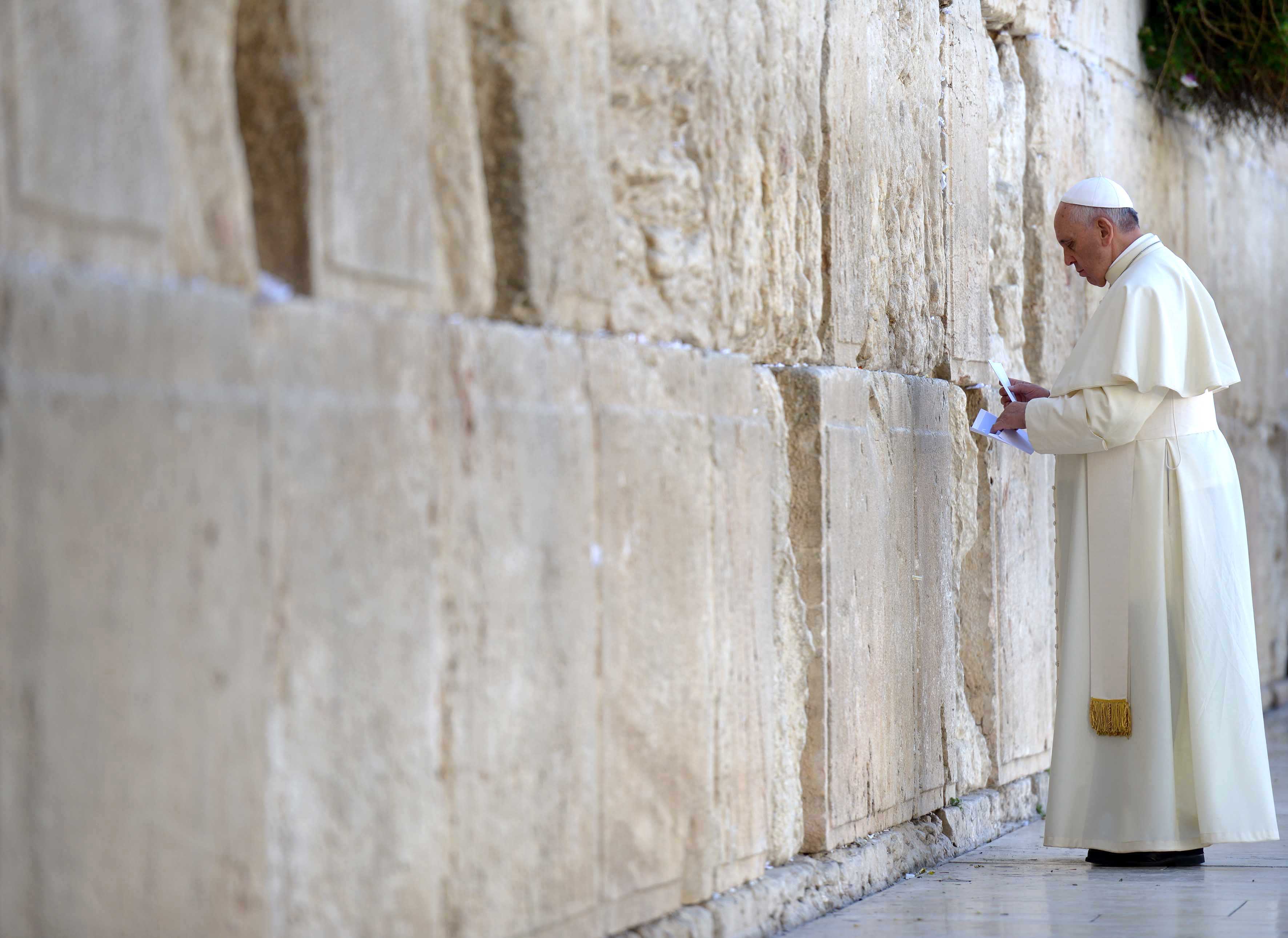 Pope Francis placing his prayer at the Western Wall, Jerusalem, 2014